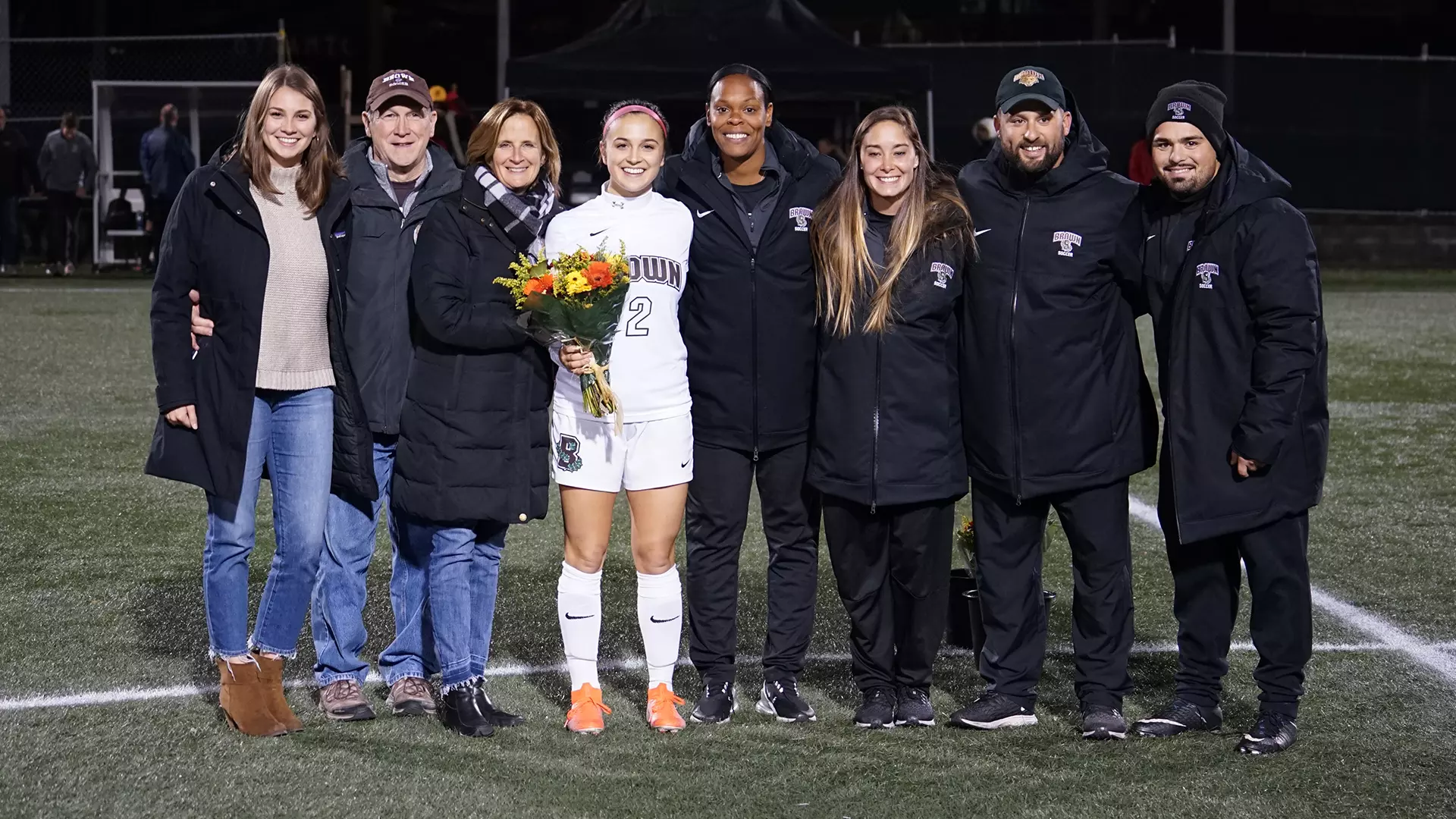 Celia Story celebrates Senior Night with her family and the Bears' coaching staff.