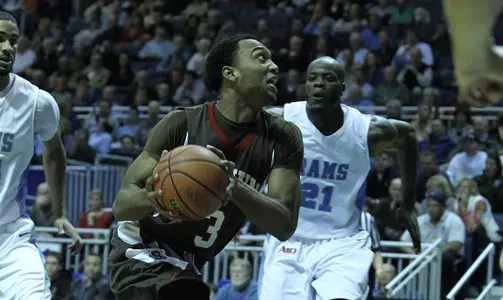 American Rallies For 77-67 Win Over Brown Image