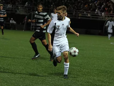 Cross Leads Men's Soccer Past UNH, 1-0, in Overtime Image