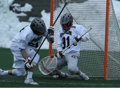 Kelly's 15 Saves, Blynn's Four Goals Lift #12 Brown Over #9 Princeton Image