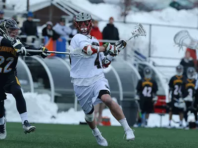 Molloy's Career High Eight Goals Lifts #20 Brown Over Michigan, 22-12 Image