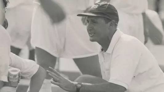 Former men's soccer head coach Trevor Adair coaching players