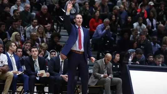 Men's basketball head coach Mike Martin instructing his team