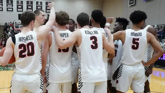 Men's basketball team huddle