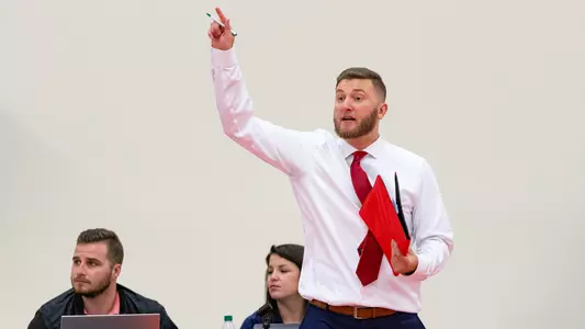 Robert Chilcoat points out a play in volleyball
