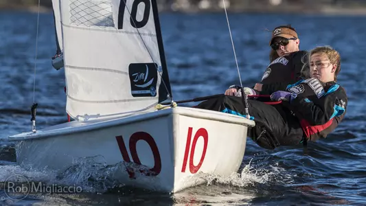 Brown sailors work together on a sunny day