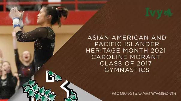 Gymnast Caroline Morant claps after a routine