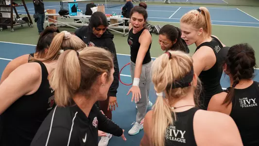 Photo of women's tennis team huddle
