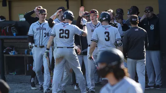 Baseball players exchange high fives