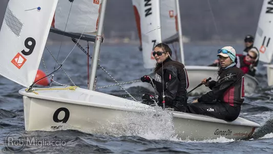 Brown sailors work together on a sunny day