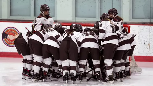 Women's hockey team huddle