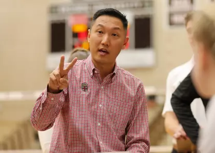 Head Coach Ahen Kim calling a play during a timeout vs Harvard 11.11