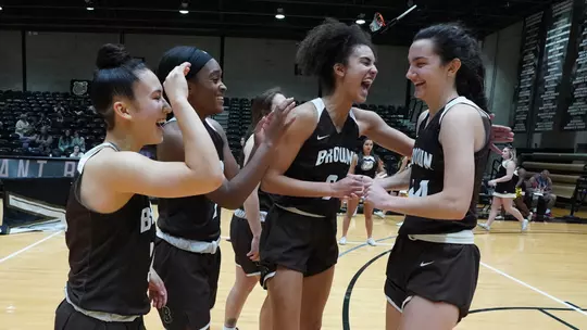 women's basketball team huddle