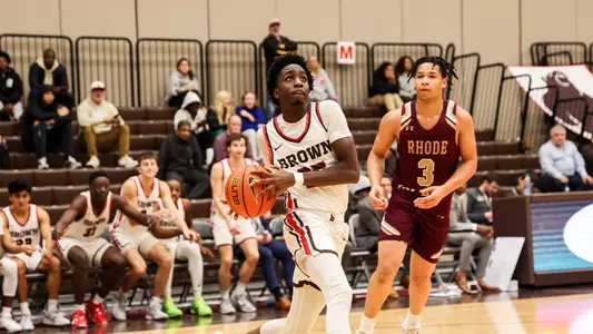 Adrian Uchidiuno drives to the basket vs RIC