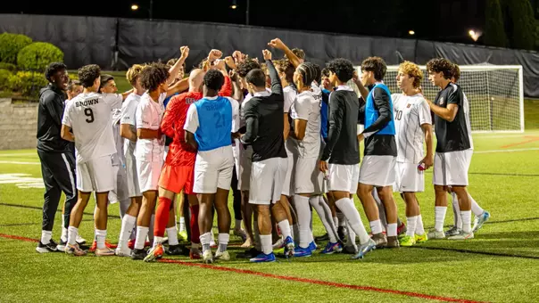 Brown men's soccer team huddle
