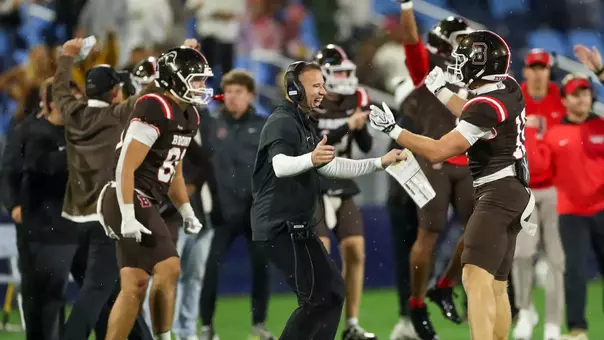 Dan Mulrooney celebrates with Tommy Dunn against Harvard in 2026