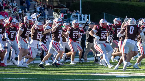 Brown storms the field to celebrate a win over Cornell in 2026