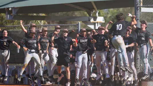 Brown celebrates a home run by Mark Henshon against Indiana State