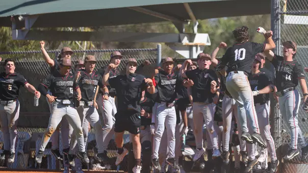 Brown celebrates a home run by Mark Henshon against Indiana State