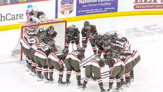 Brown women's hockey huddle vs Quinnipiac