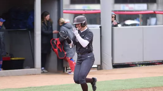 Elli Thompson celebrates a home run