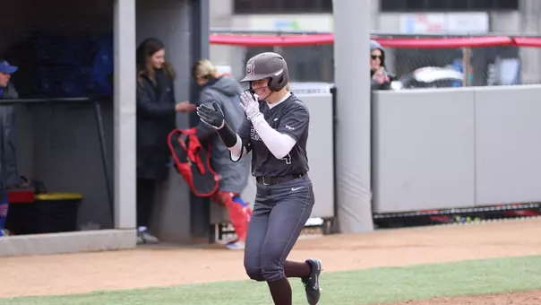 Elli Thompson celebrates a home run