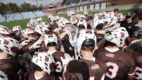The Brown men's lacrosse team huddling