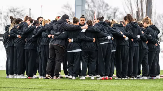 The Brown women's lacrosse team huddling