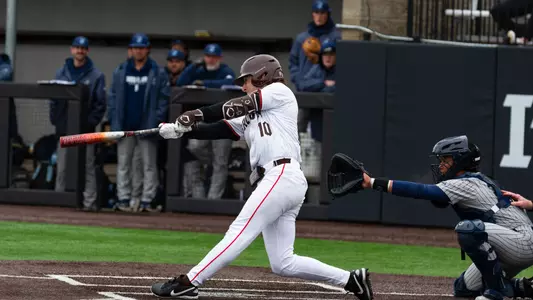 Mark Henshon bats against URI in March 2026