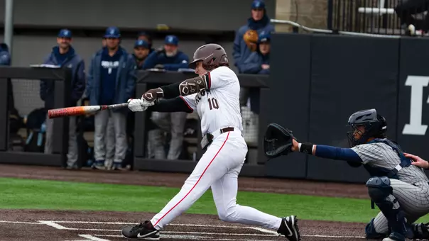 Mark Henshon bats against URI in March 2026