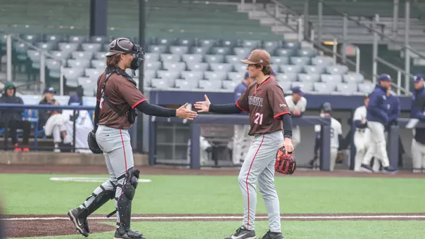 Jack Edmunds and Camren Piwnicki celebrate a win over Yale