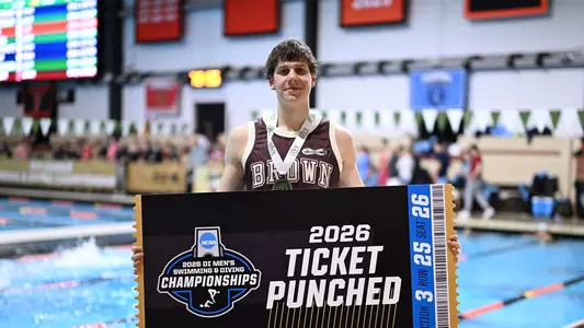 Marton Nagy holding the clinched ticket after winning the 400 IM at the 2026 Ivy League Men's Swimming and Diving Championship