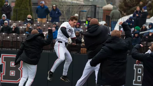 Brown and Christian Butera celebrate a home run against URI