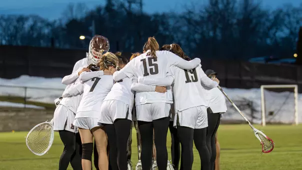 Women's Lacrosse Huddle Against Holy Cross