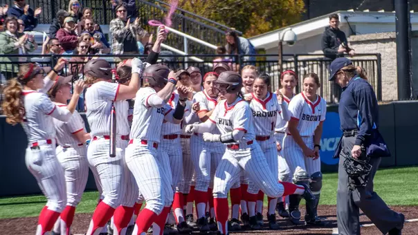 Abby Bettencourt Celebrates a Home Run with her teammates