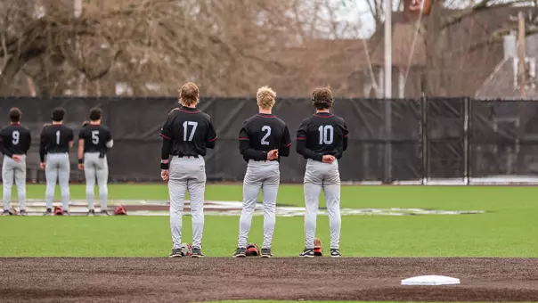 Brown players pose for the national anthem pregame