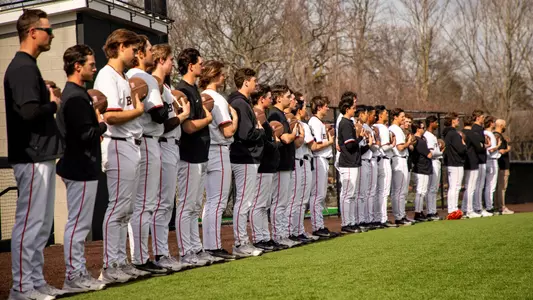 Brown stands for the national anthem prior to a game vs. Bryant