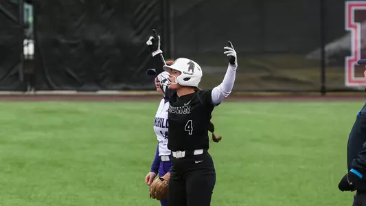 Elli Thompson celebrates at second base after a double
