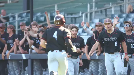 Brown's bench celebrates a run against Yale