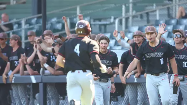 Brown's bench celebrates a run against Yale