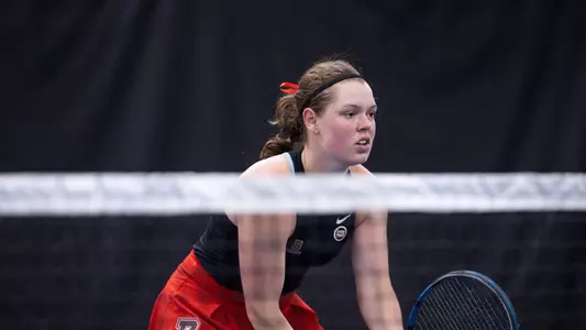 Anne Moody awaits the serve
