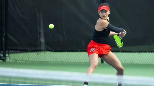 Hannah Shen hits the tennis ball