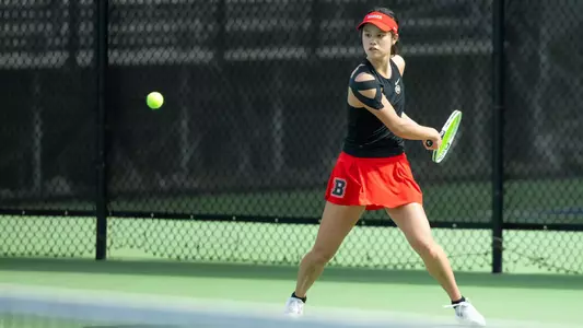 Sari Woo hits the tennis ball