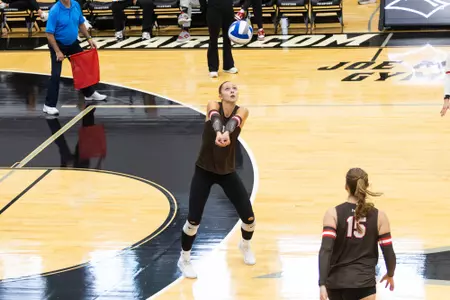Eve McLaury digs a ball