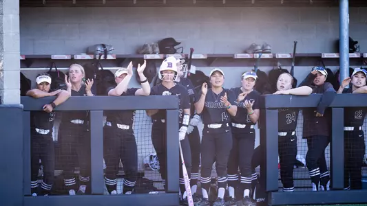 Brown softball dugout cheers against Penn