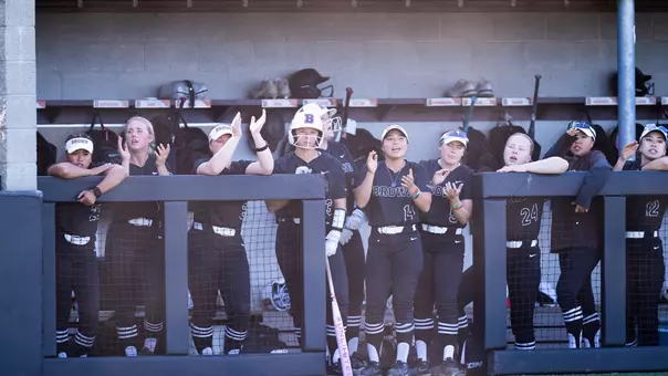 Brown softball dugout cheers against Penn