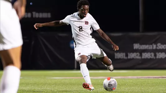 Iyke Dafe kicks the soccer ball