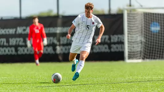 Mathias Hille dribbles the soccer ball