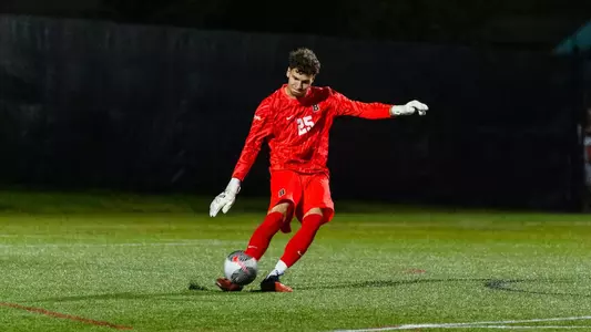 Max Pfaffman kicks the soccer ball