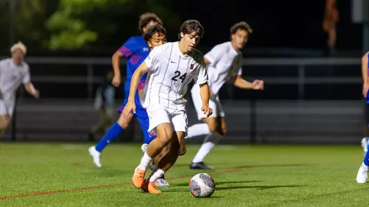 Sawyer Turiace carries the soccer ball up the field